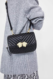 CROSSBODY BELT BAG WITH LION DETAILS